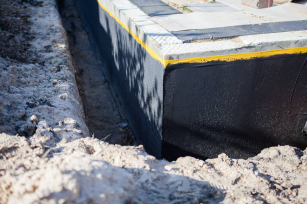 Professional Waterproofing technician working in Islip Terrace, NY
